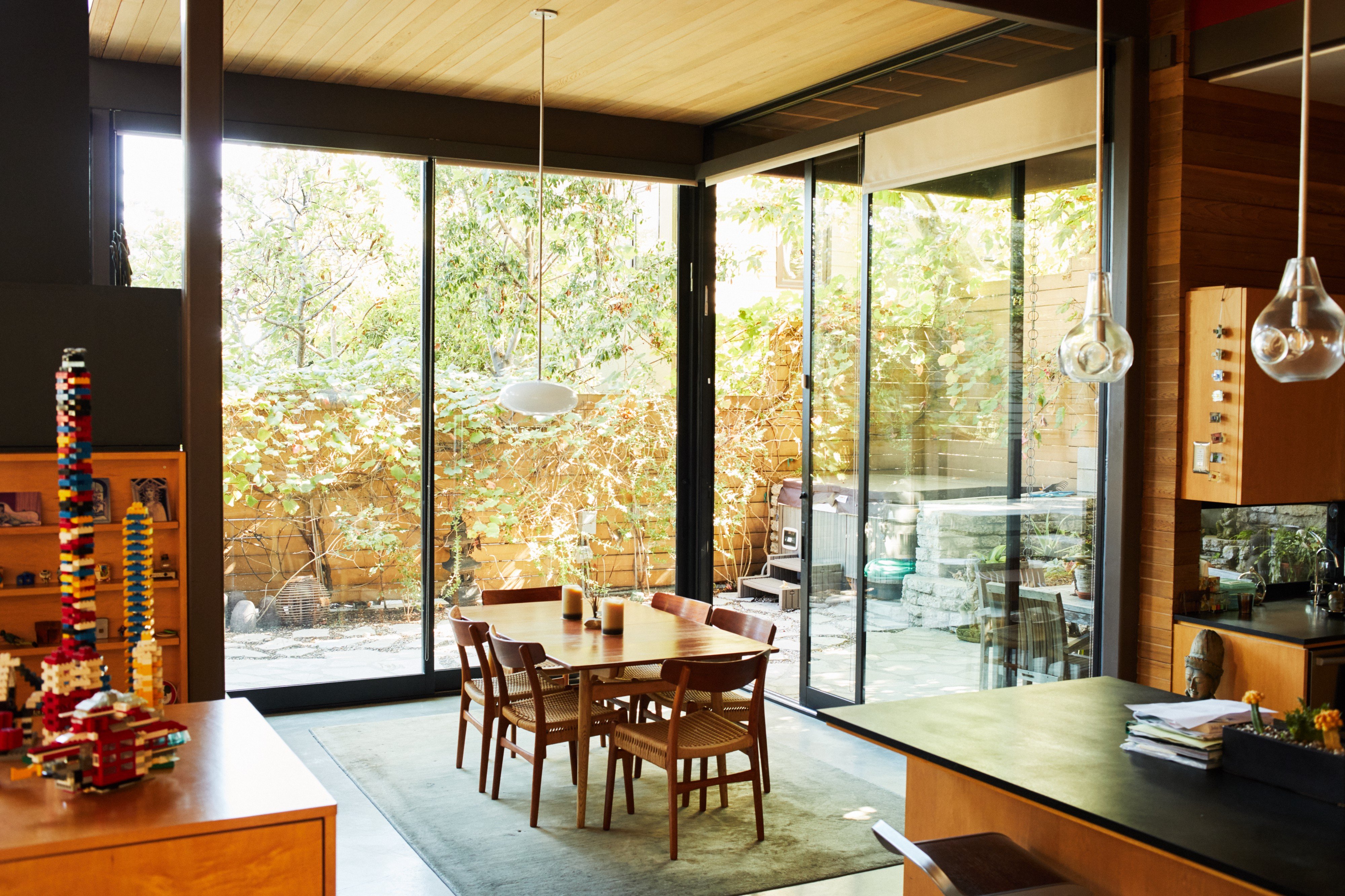 In Plant Prefab’s show home, the house is constructed of Lego-like modules where open rooms can flex into private bedrooms, and the outdoor garden converts into an extension of the indoor dining room.